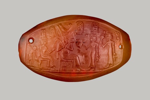 Carnelian carved bracelet plaque of the 18th Dynasty pharaoh Amenhotep III, depicting the ruler enth