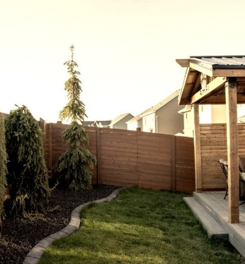 Modern Deck - Roof ExtensionsDeck - Small Modern Backyard Ground Level Deck Idea With A Roof Extension