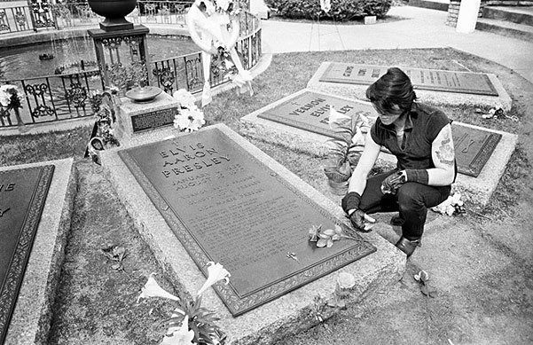 holidazehalloween:  Glenn Danzig visits the grave of Elvis.
