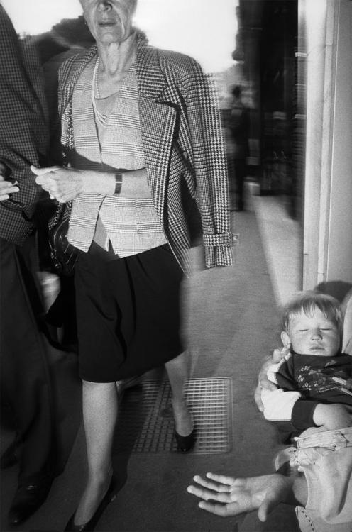 Cannes Film Festival, Cannes, France (1991)Couple passing Gypsy woman with child on La Croisette, Ca