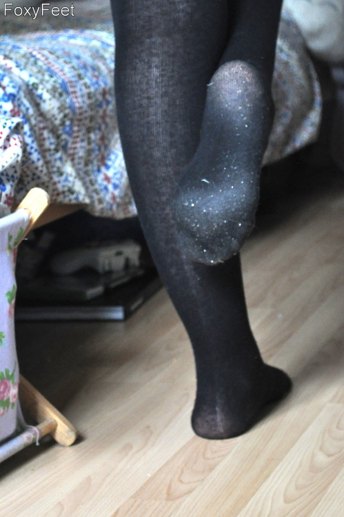 My wife wearing very dusty black tights, removing them to reveal her cute feet :) Excuse the bedroom