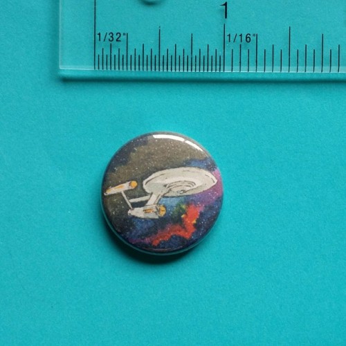 elisafriesen:Buttons! These are ink and watercolor paintings of TOS NCC-1701, Next Gen’s NCC-1701-D,