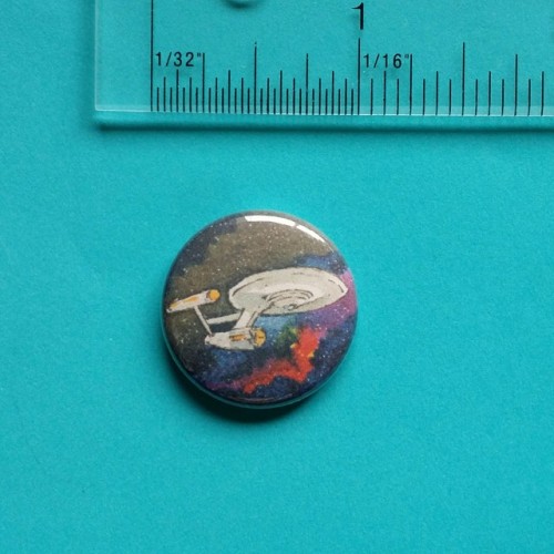 elisafriesen:Buttons! These are ink and watercolor paintings of TOS NCC-1701, Next Gen’s NCC-1701-D,