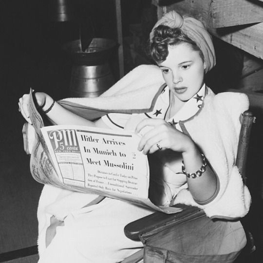 franciegummstarstruck:Judy Garland reading the news between takes on the set of ‘‘Strike