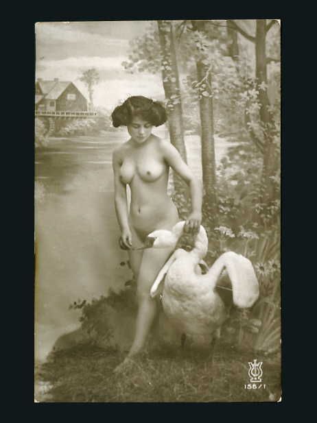 And here we have a naked woman chilling with a taxidermied swan on a fake riverbank.Because,