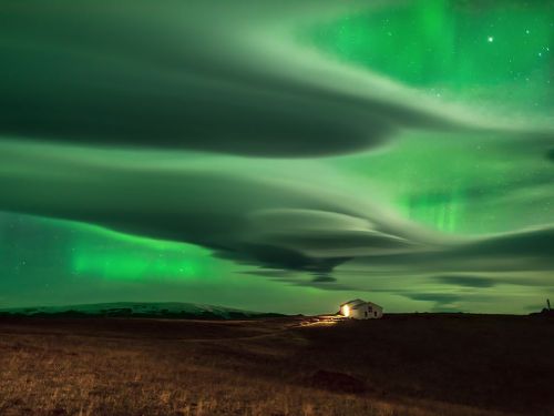 Northern Lights Over IcelandThe aurora borealis sets the Iceland sky alight with an otherworldly glo