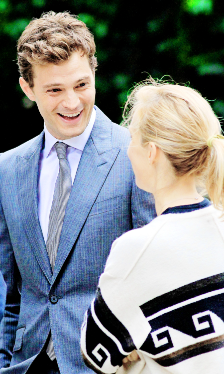 fiftyshadesofgreyinspiration:    Jamie Dornan and Sam Taylor Johnson -  Fifty Shades of Grey reshoots  source:jamie-dornan.org   I love his smile, my smail.