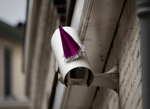 unicorn-meat-is-too-mainstream:  DECORATING SURVEILLANCE CAMERAS WITH PARTY HATS TO CELEBRATE GEORGE ORWELL’S BIRTHDAY