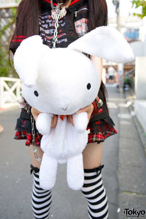 tokyo-fashion:  18-year-old Ringo on the street in Harajuku wearing a gothic outfit by h.Naoto with striped socks, Question Mark shoes, and a big bunny. We’ve been seeing Ringo around Harajuku quite a bit lately and she’s always super sweet. Full