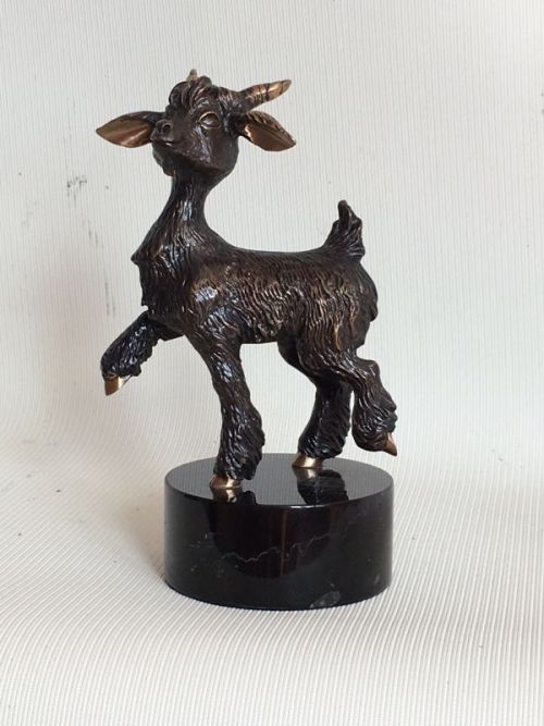 A sculpture titled ‘Goat (Little Young Goat Kid Bronze statuette)’ by sculptor Vitaliy Semenchenko. In a medium of Bronze and in an edition of 1/9. #artist#sculpture#sculptor#art#fineart#Vitaliy Semenchenko#Bronze#metal#limited edition