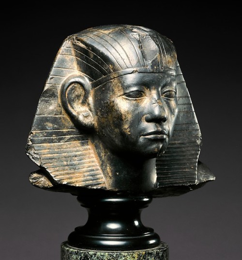sadighgallery:  Granodiorite Head of a Statue of Amenemhat III  Ancient Egypt, Middle Kingdom, 12th Dynasty (ca. 1859-1813 B.C.) Amenemhat III here wears a nemes headdress, a folded and pleated piece of cloth generally reserved for the pharaoh. The head
