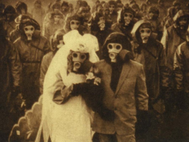 sixpenceee:
“ Wedding picture in Izu Island in Japan. The habitants used gas masks because there were high levels of sulfur in the air due to volcanic activity.
”