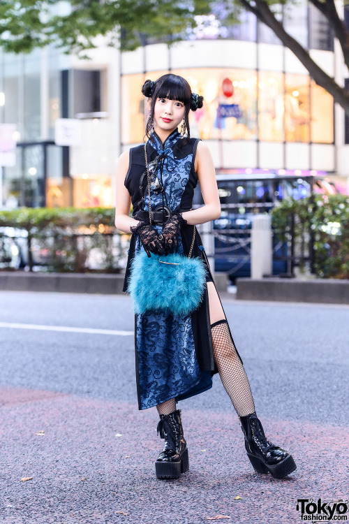 Harajuku shop staffer Misuru on the street wearing a twin buns hairstyle, black lace gloves, a Qutie