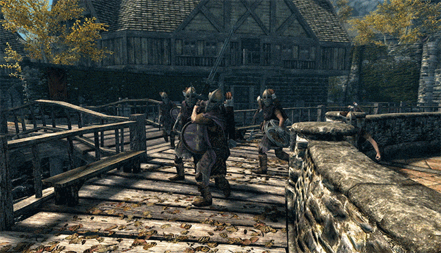 A group of Riften guards preparing to attack. One swings his weapon, but they are all blown away over the bridge they are standing on.