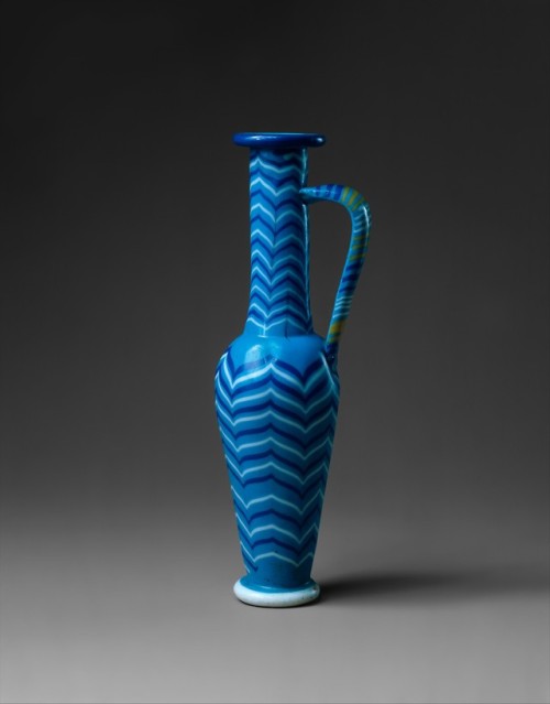 historyarchaeologyartefacts:Spindle bottle made from blue, white and yellow glass. Egypt, 18th dynas