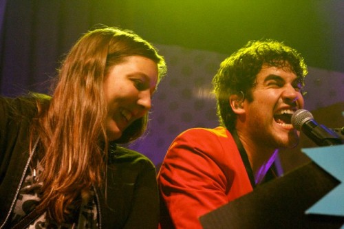 Darren Criss with a fan on stage in concert at The Fillmore in San Francisco, CA