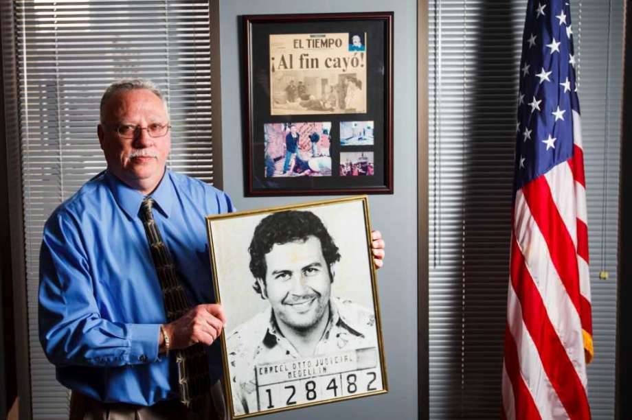 The DEA&rsquo;s new Houston Division Chief, Javier Pena, holds a photo of the