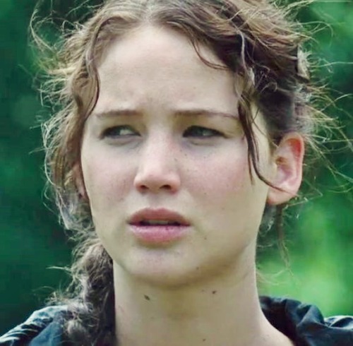 Jennifer Lawrence as Katniss Everdeen and Josh Hutcherson as Peeta Mellark in The Hunger Games.