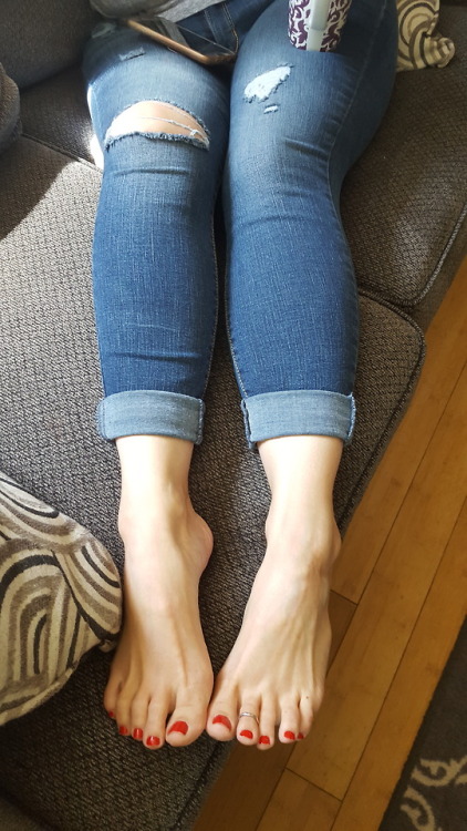 My pretty wife having a coffee bare foot on the couch looking adorable.please comment