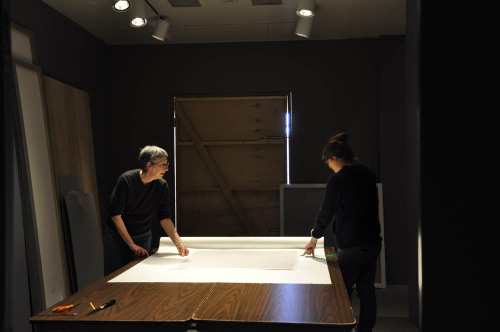 Chief Conservator Esther Méthé and conservation intern Annaïck Keruzec are rehousing our oversize te