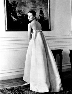 soaudreyhepburn:  On April 26, 1958 Audrey Hepburn wears a pale lavender gown Hubert de Givenchy, during a fitting session with the designer in Rome