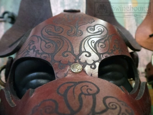 misterswinehound:  Two dog masks for the Anthrocon art show. The design engraved on these was created by my partner-in-artistic-crime over at http://bonepile.tumblr.com/.  We put the masks together.  I think they came out really great.