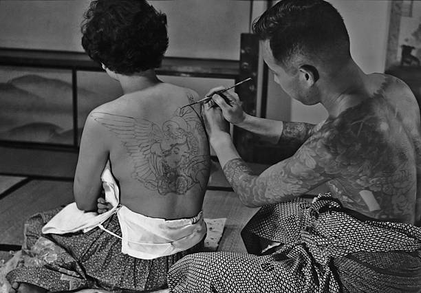 s-h-o-w-a:Tattoo artist Horigoro at work on a design on a woman’s back in Japan