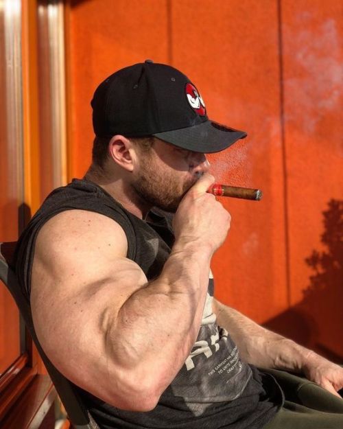 submissiveboy19:  The bicep. The cigar. The stature.You’ll bleed your account empty for the possibility of sitting at this man’s feet.