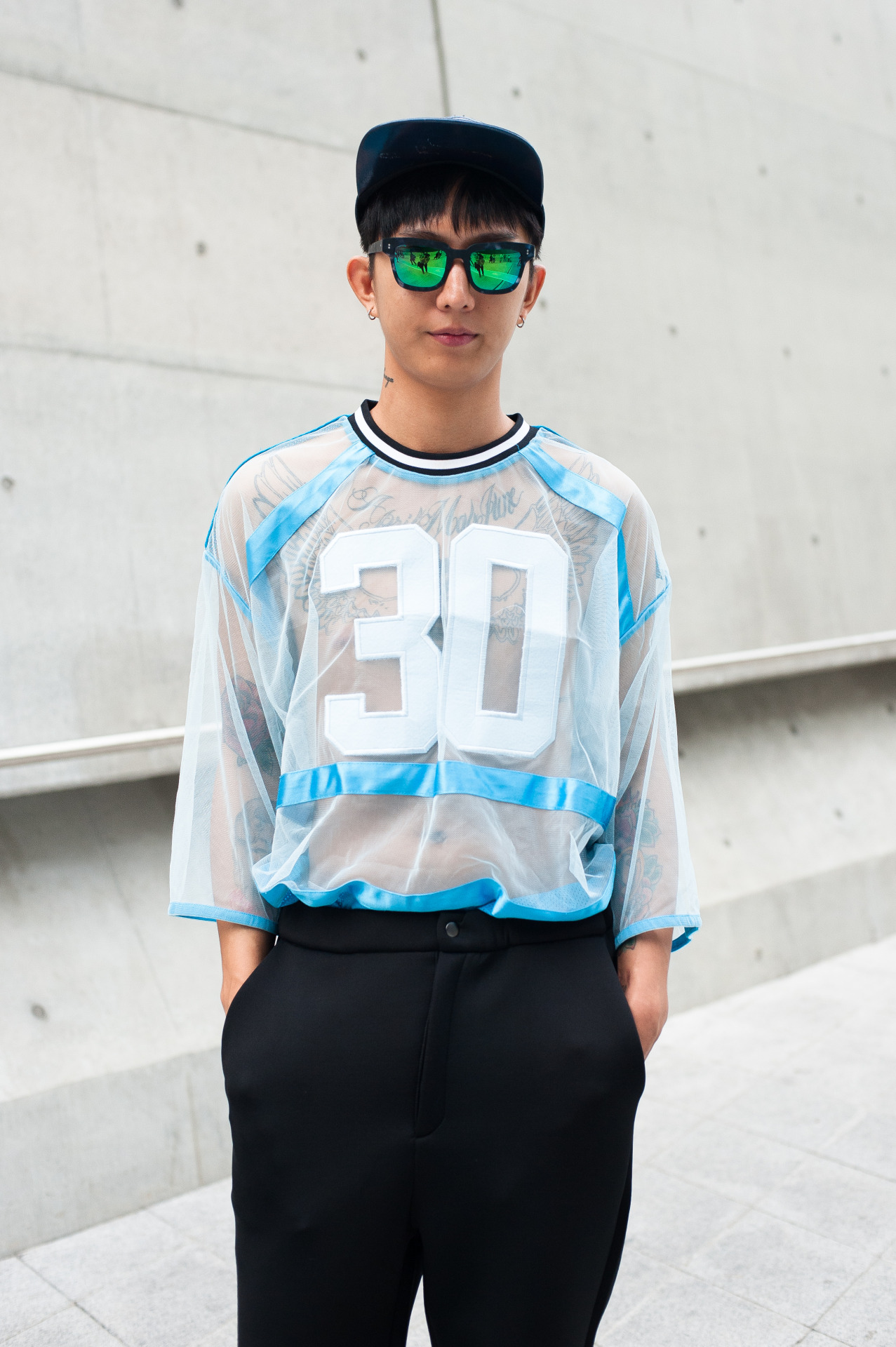 wgsn:  Sheer varsity top over tattoo for the best personalisation of the sports casual