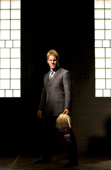 Sex Jericho in a dark alley, wearing a suit with pictures