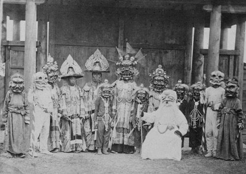 Tsam dance troupe where Sagaan Ubgen is seated at front right, 1880