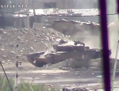 mikes-place: just-remington:     If this is the footage that I think it is, a cameraman thought it would be a good idea to step out from behind a building and point something from his shoulder at a tank. 
