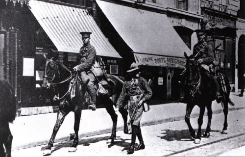 georgy-konstantinovich-zhukov:A Boy Scout accompanies British Cavalry through an unidentified town i