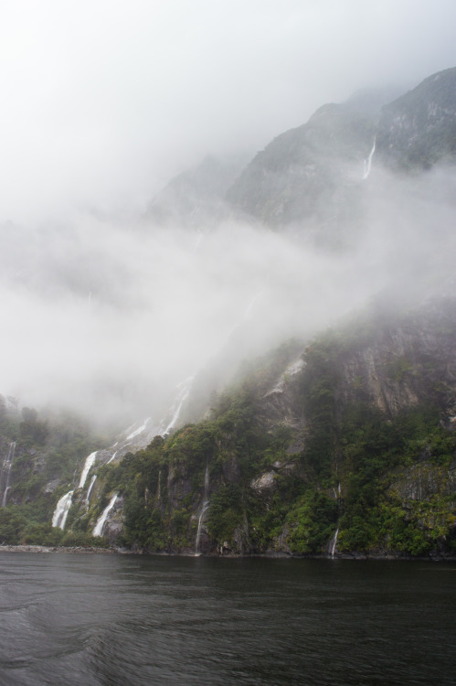 Waterfalls and clouds at Milford Sound.Milford Sound, Fiordland, South Island, New Zealand