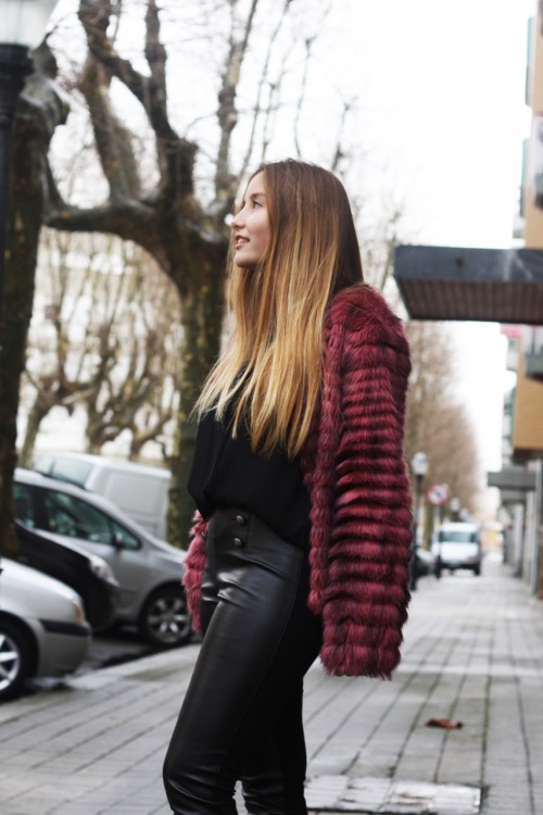 A burgundy faux fur coat with high-waisted faux leather leggings is the perfect combination for a to