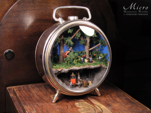 Here’s my latest miniature world, this time built inside in a vintage clock case. A man and a 