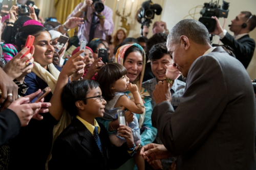 Eid Mubarak! President Obama greets a family at an Eid Al-Fitr reception in 2016. Series: Presidenti