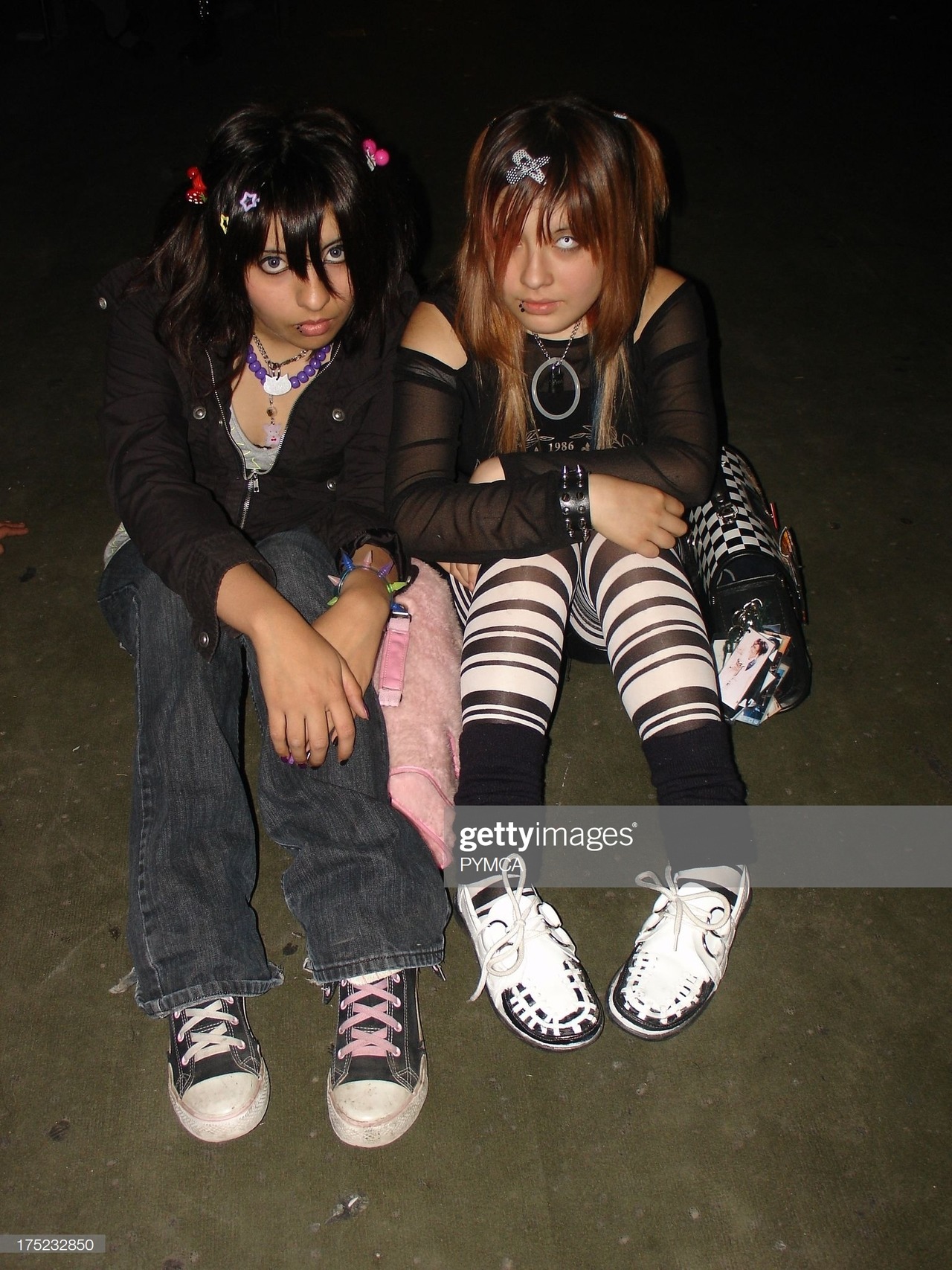 Two young Emo girls with attitude sitting on the floor, Santiago, Chile 2007