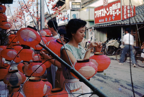 People prepare paper lanterns prior to the Tanabata Festival on August 7, 1954 in Yamaguchi, Japan. 