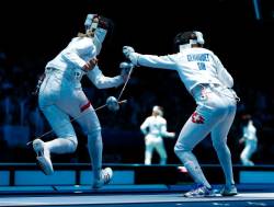 modernfencing:  [ID: an epee fencer dropping