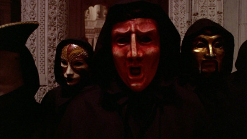 Tom Cruise witnesses something he’s not supposed to see, in EYES WIDE SHUT (1999) by Stanley Kubrick