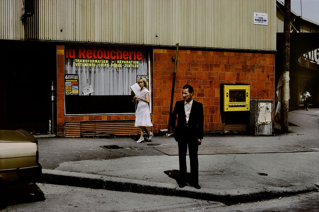 Harry Gruyaert
“FRANCE. Île-de-France region. Seine-Saint-Denis department. La Courneuve. Streetscene, 1985.” (1985)