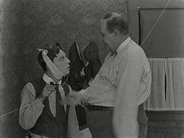&ldquo;Big Joe&rdquo; Roberts attempts to pull Buster Keaton’s tooth in