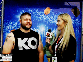 mithen-gifs-wrestling:  Kevin Owens on having people cosplay him.The image of wrestlers scoping the crowd for each other, spotting interesting people who deserve attention, and reporting back:  charming.The image of Brock Lesnar doing that for Kevin