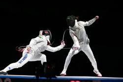 modernfencing:  [ID: a foilist lunging and