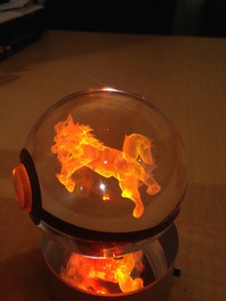 archiemcphee:  Lexington, KY-based designer and serious Pokémon enthusiast PokeMaster Crafter makes awesome crystal Poké Balls containing 3D etchings of Pokémon creatures that glow when places on colored LED bases.“Each Poke ball is made of a high