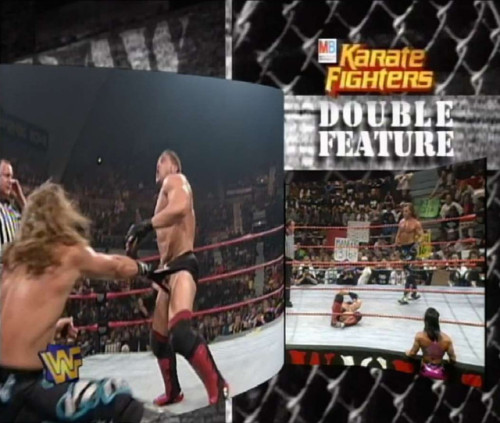 Ken Shamrock front of tights pulled by Shawn Michaels.