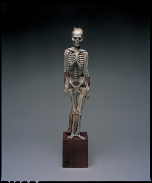 sixpenceee:  The bizarre art of Yoshitoshi Kanemaki. He chisels these life-sized figurative sculptures out of giant pieces of camphor wood, a kind of evergreen. The strange pieces frequently involve two or more characters merged into a single form, which