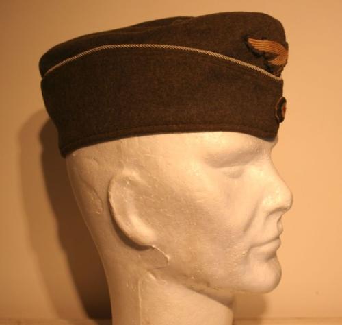 The side cap (also known as the garrison cap, wedge cap, field service cap, or {most picturesquely} 