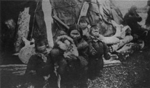 Chukchi children and mother in front of a yaranga (Cape Vankarem, 1881).